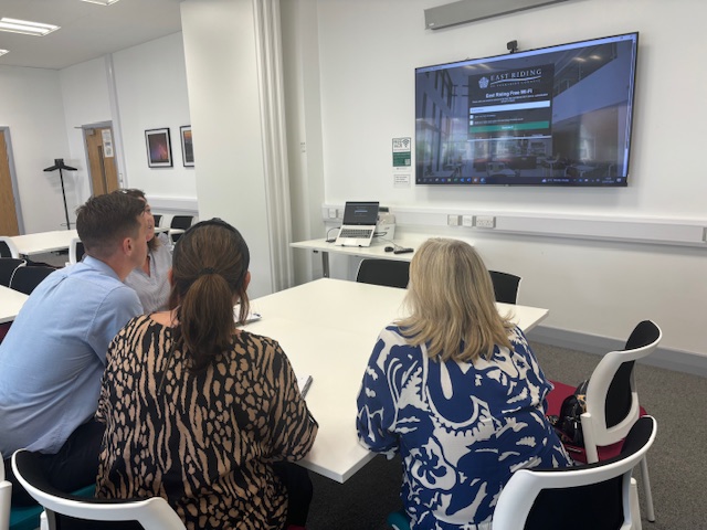 Image shows people logging into the wi-fi service at the Beverley Enterprise Centre.